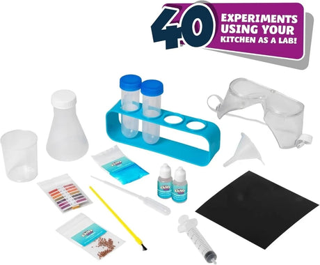 Amazing Kitchen Chemistry kit contents showing safety goggles, test tubes, test tube rack, conical flask, funnel, pipette, syringe, colouring and experiment materials