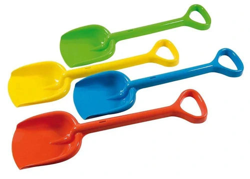 Four assorted plastic spades in green, yellow, blue and red arranged diagonally on a plain background