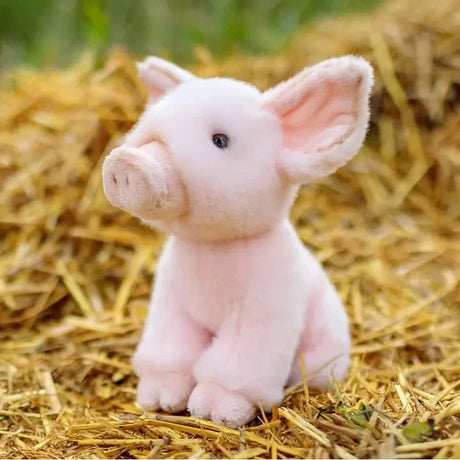Animigos World of Nature pink piglet plush sitting on straw