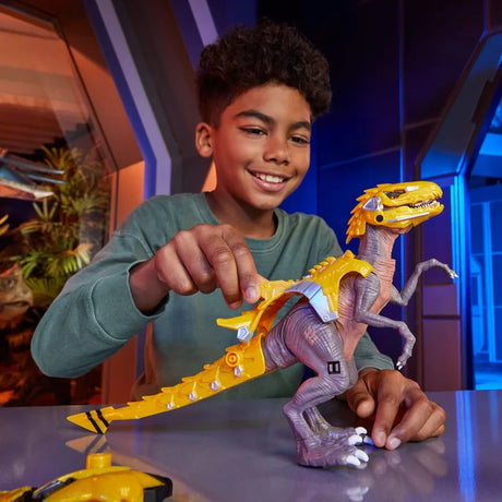 Child attaching yellow armour to the Armorsaurs Yellow Raptor Dinosaur Blaze toy figure