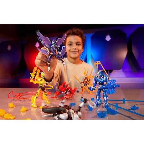 Child holding a blue Armorsaurs figure with yellow, red and grey action figures and loose armour parts on a table