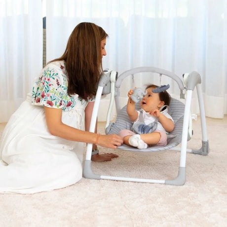 Asalvo Daddy Hippo Musical Baby Swing shown with a baby and adult during use