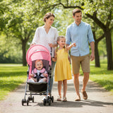 Family walking in a park with a pink stroller and children