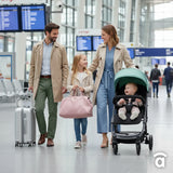 Family walking through an airport with an Asalvo Kubic 2 green and black stroller