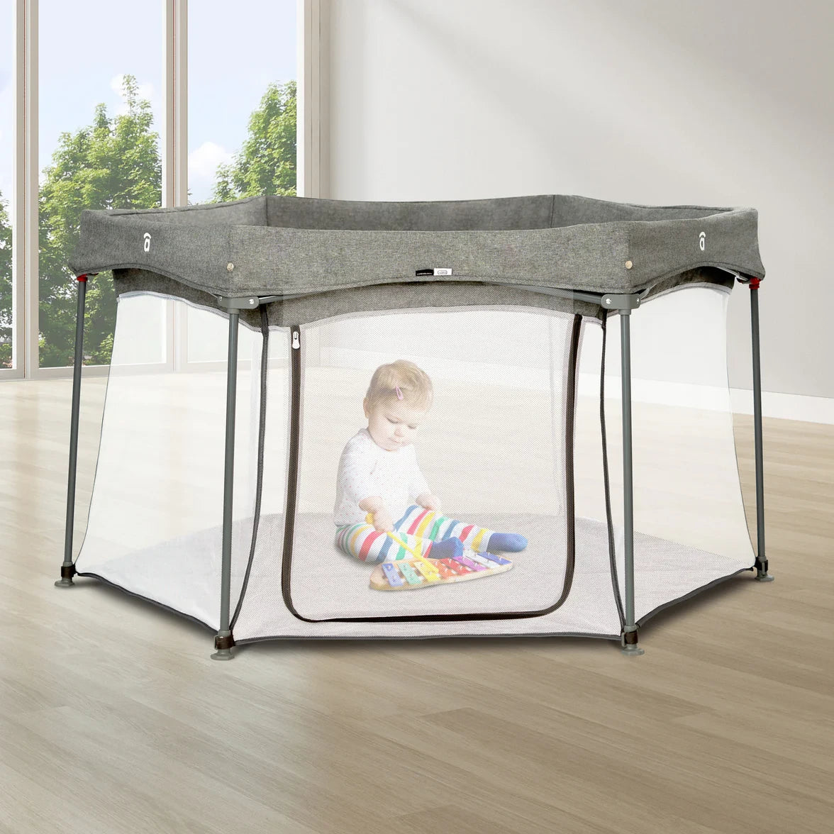 Asalvo Luxemburgo Playpen shown in a bright room with baby playing inside