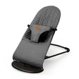 Angled view of the grey Asalvo Paradise baby bouncer showing the padded seat and black frame