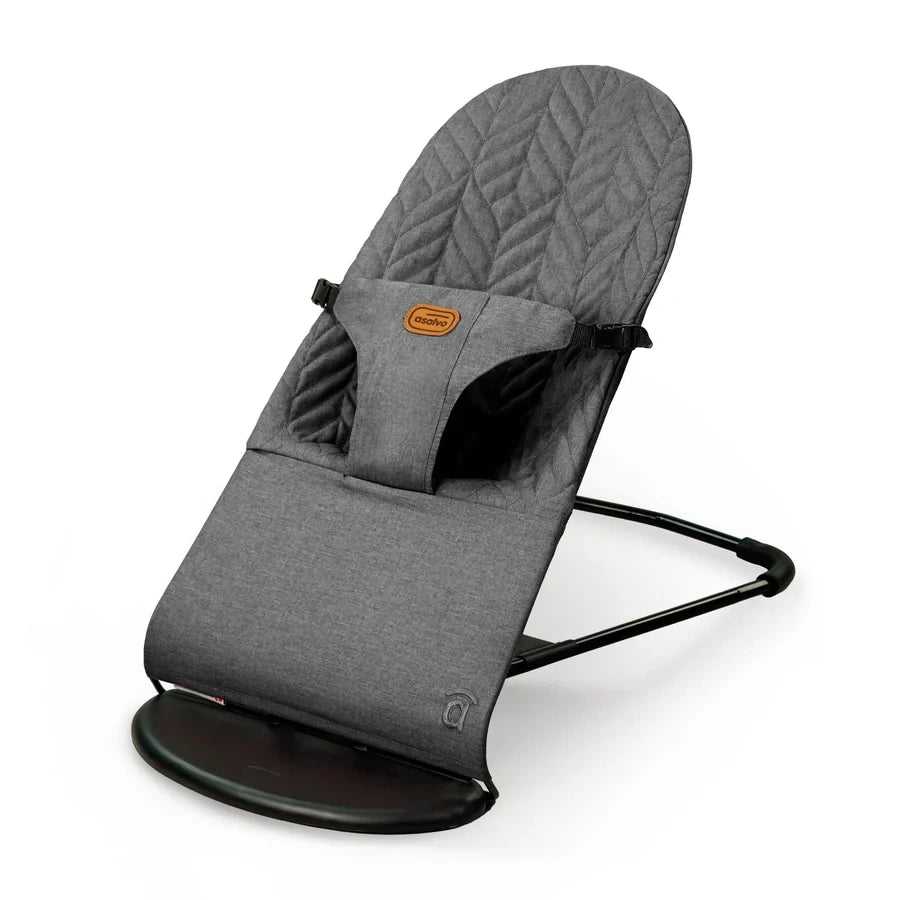 Angled view of the grey Asalvo Paradise baby bouncer showing the padded seat and black frame