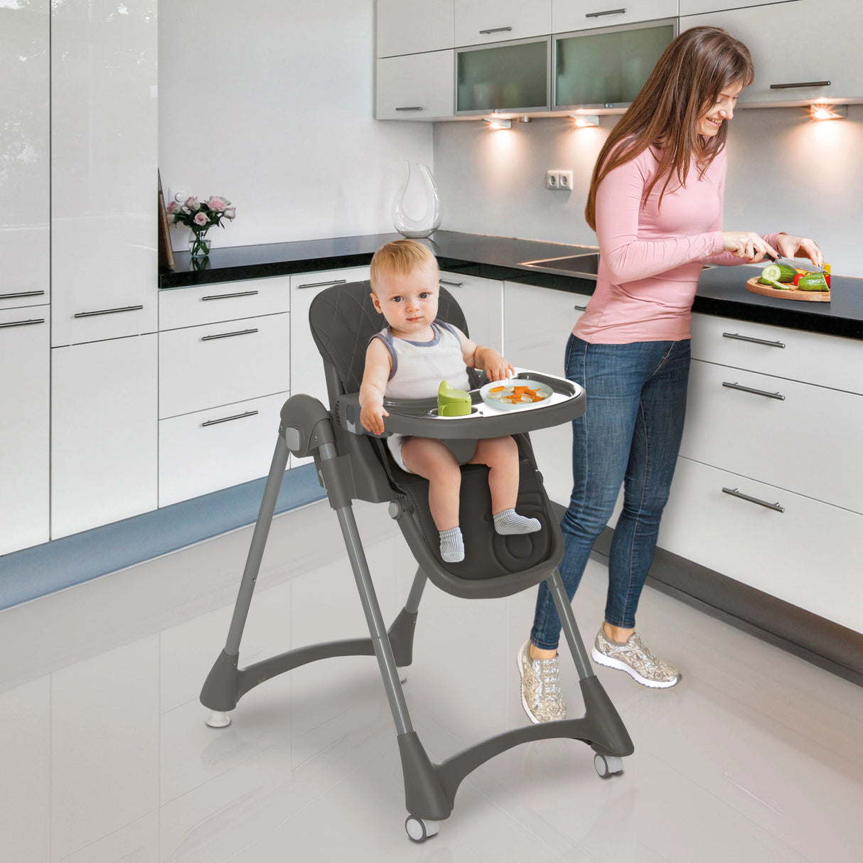 Asalvo Soja Mimosa Highchair shown in a kitchen with child seated and tray in use