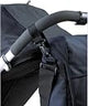 BabaBing DayTripper Lite Midnight Blue changing bag clipped to a pushchair handle 