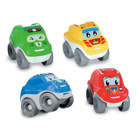 Baby Clementoni Tumbling Cars Rescue Force assortment showing four cartoon rescue vehicles in green, yellow, blue and red, with smiling faces and large grey wheels on a white background.