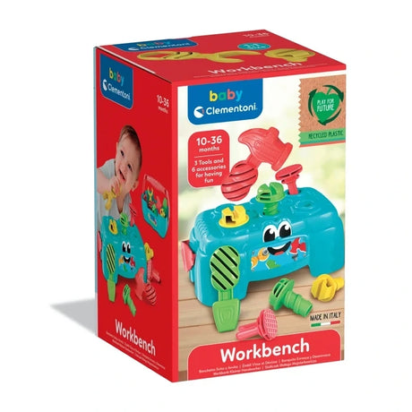 Baby Clementoni Workbench retail box showing the turquoise workbench with colourful tools, 3 tools and 6 accessories included, and 10 to 36 months age marking.