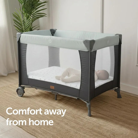Baby Elegance Safari jersey fitted sheet on travel cot in nursery room