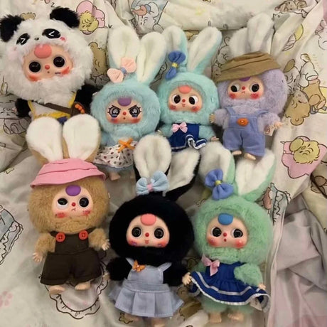 Display of Baby Three Twelve Zodiac V2 plush toys arranged in rows on a blanket.
