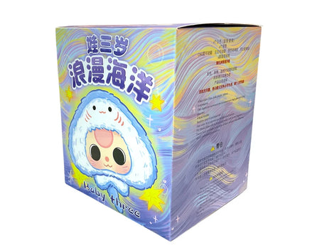 Side of Baby Three Romantic Ocean box with series details and wave pattern background