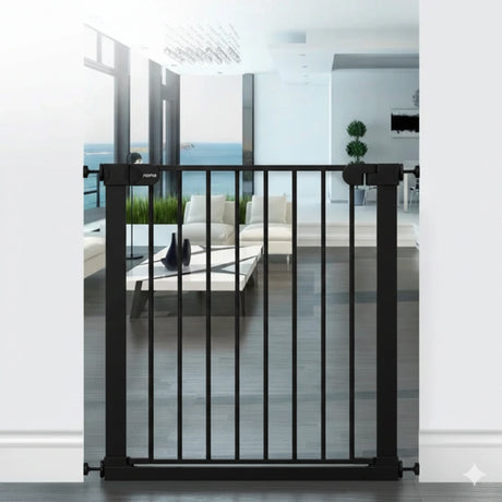 Babylo Easy Fit Flat Bar Safety Gate in black installed within a white doorway frame, showing vertical flat bars, central walk through opening and slim handle with pressure mount spindles at each side