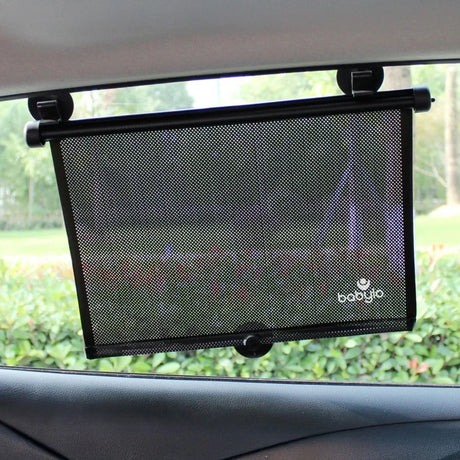 Babylo roller sunshade attached to a car side window inside a vehicle