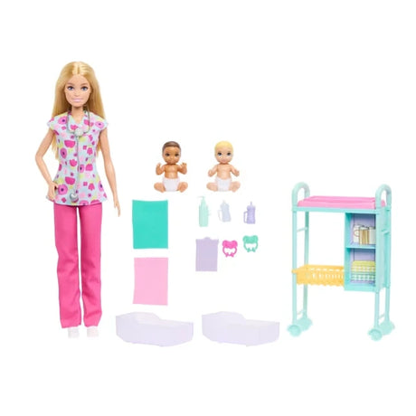 Barbie Careers Baby Doctor set with blonde Barbie doll wearing floral medical scrubs and pink trousers, two baby dolls, a turquoise examination trolley, blankets, bottles, pacifiers and medical accessories arranged on a white background.