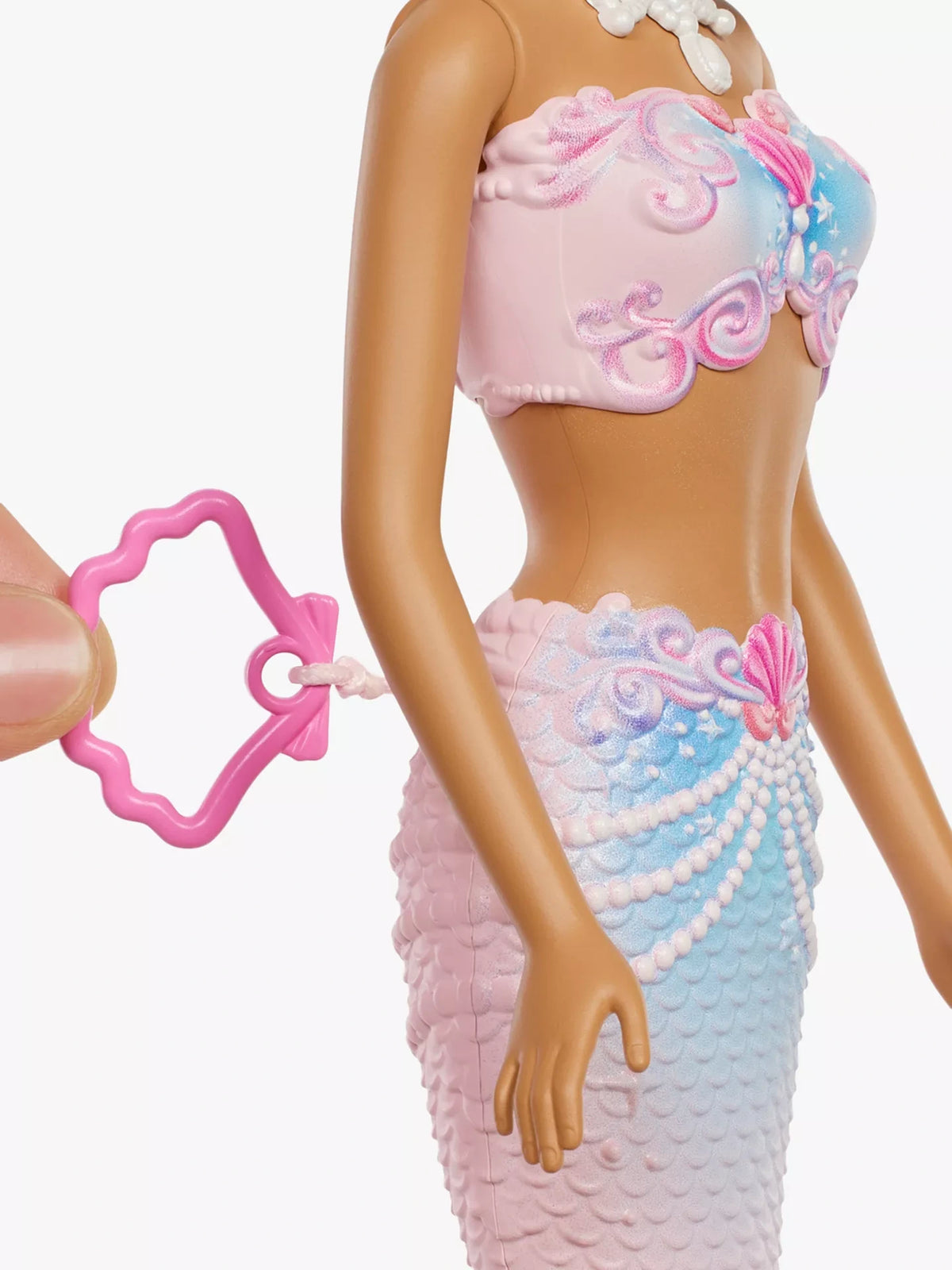 Barbie Bubble Sparkle Mermaid close view showing pink seashell pull tab beside her tail