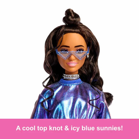 Close-up of Barbie Deluxe Style Doll with icy blue sunglasses and top knot hairstyle.