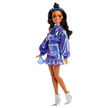Barbie Deluxe Style Doll wearing metallic blue top, ruffle skirt, and silver boots.