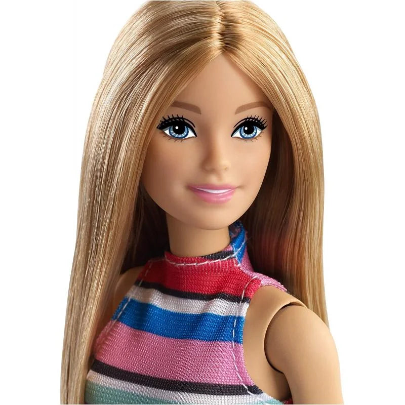 Close-up of Barbie fashion doll with blonde hair, blue eyes, and striped top
