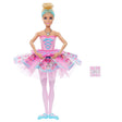 Barbie In The Nutcracker Clara Doll with her hands together over a pink patterned tutu, pale pink tights and blue ballet shoes.