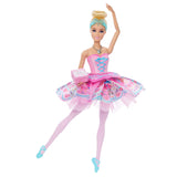 Barbie In The Nutcracker Clara Doll with one arm raised, one leg extended, a pink patterned tutu and a small pink gift box.
