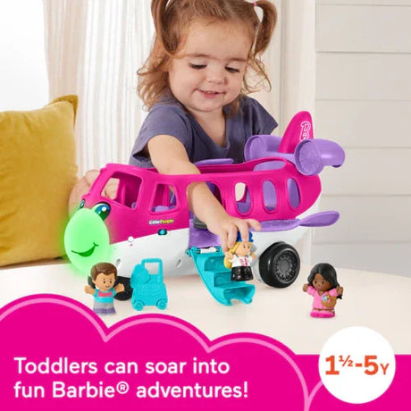 Toddler placing pilot figure into the Fisher Price Barbie Little People airplane with light-up nose and blue stairs