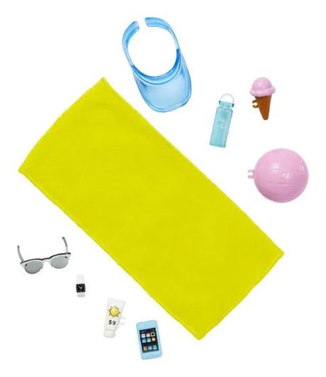 Ken beach set accessories laid out: towel, visor, sunglasses, volley ball, watch, water bottle, sunscreen and phone