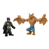 Batman figure standing beside the winged Man Bat figure