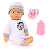 Bayer Kiss Baby Doll in pink outfit with bottle and dummy accessories on white background