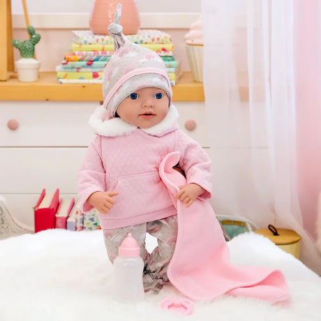 Bayer Reborn baby doll in pink outfit with bottle, dummy and blanket 