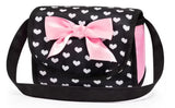 Matching black and pink heart patterned doll bag with pink bow displayed alone