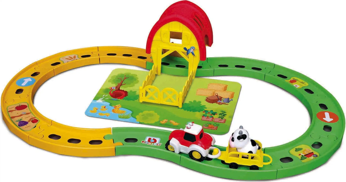 BB Junior farm tractor set showing the full track layout with tractor, yellow trailer, cow and barn