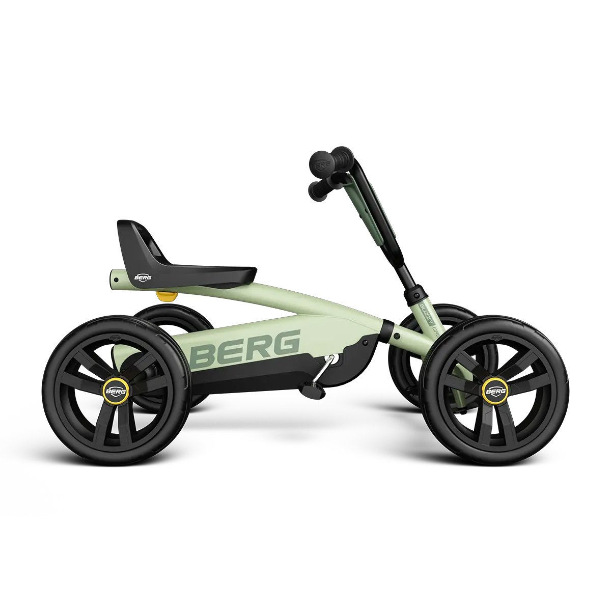 Side view of the BERG Buzzy Green pedal go-kart with green frame, black seat and black wheels