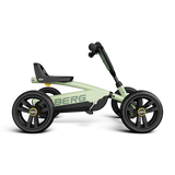 Side view of the BERG Buzzy Green pedal go-kart with green frame, black seat and black wheels