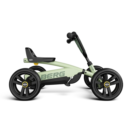 Side view of the BERG Buzzy Green pedal go-kart with green frame, black seat and black wheels