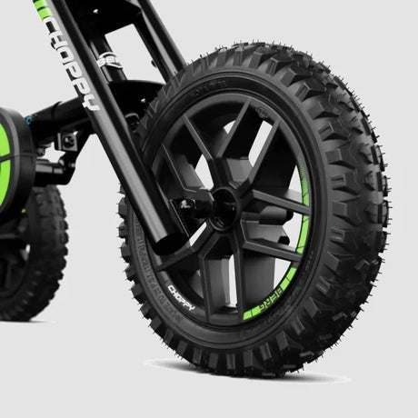 Close-up of BERG Choppy Neo Go-Kart black wheel with knobby tire and green detailing – Ireland