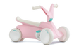 Angled view of pink BERG GO² ride-on with white wheels, white saddle and teal pedal details