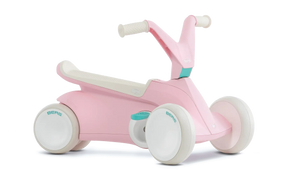 Angled view of pink BERG GO² ride-on with white wheels, white saddle and teal pedal details