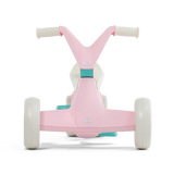 Front view of pink BERG GO² ride-on with white wheels, white handlebar grips and teal pedal details