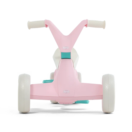 Front view of pink BERG GO² ride-on with white wheels, white handlebar grips and teal pedal details