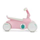 Side view of pink BERG GO² ride-on with white wheels, white saddle and teal pedal details