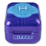 Front view of the closed purple Bitzee pod showing its rounded case, turquoise Honmoon emblem on the lid and blue Bitzee logo below the opening.