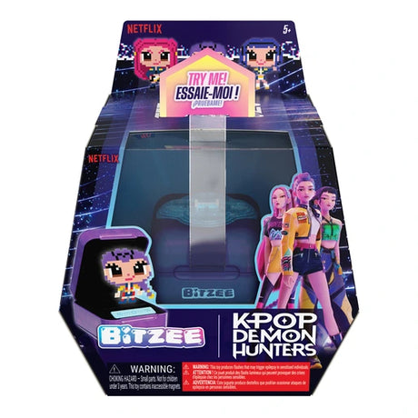 Front of Bitzee KPop Demon Hunters retail packaging featuring the purple electronic pod, HUNTR/X members Rumi, Mira and Zoey, pixel-style characters and Netflix branding.