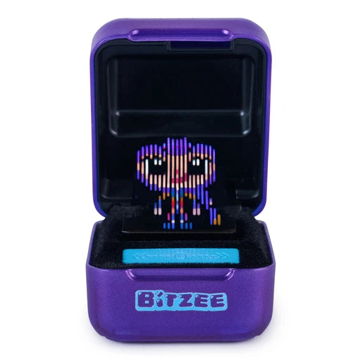 Open purple Bitzee KPop Demon Hunters pod displaying a colourful pixel-style character with large eyes above the turquoise touch control bar.
