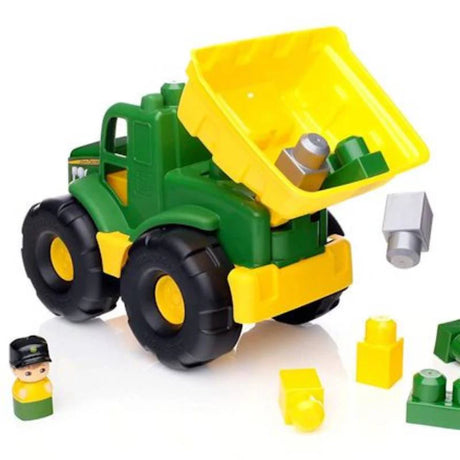 Blocks Kingdom Giant Farm Tractor with Bricks in green and yellow with the rear dumper raised, loose block pieces and a small figure