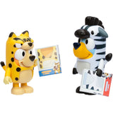 Bluey and Bingo in zebra and cheetah animal costume onesies holding cards – Ireland