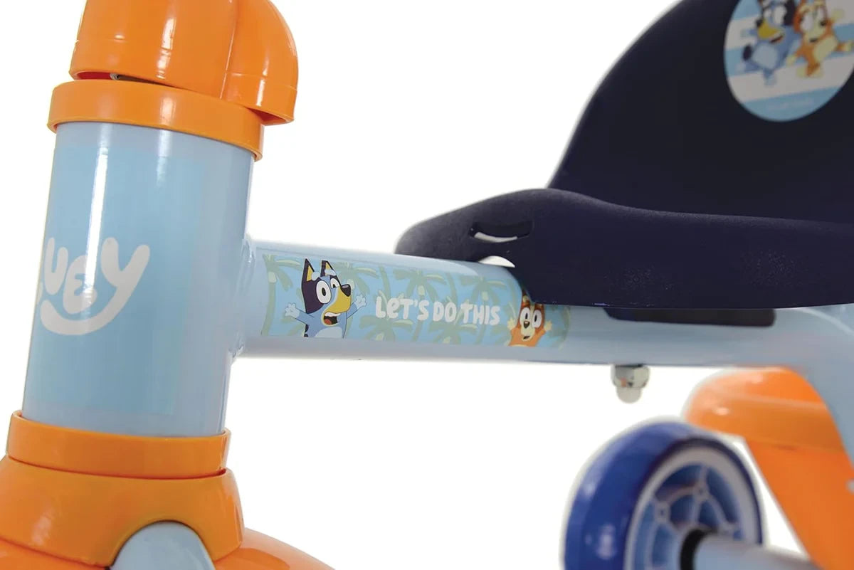 Close up of Bluey My First Trike frame, navy seat, rear wheel and Bluey character graphics