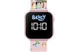 Bluey kids LED watch with pink alloy case, white digital display and character print strap with Bluey and Bingo in action poses